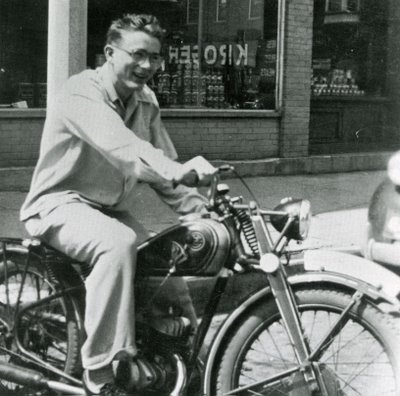 young james dean on motorcycle smiling 