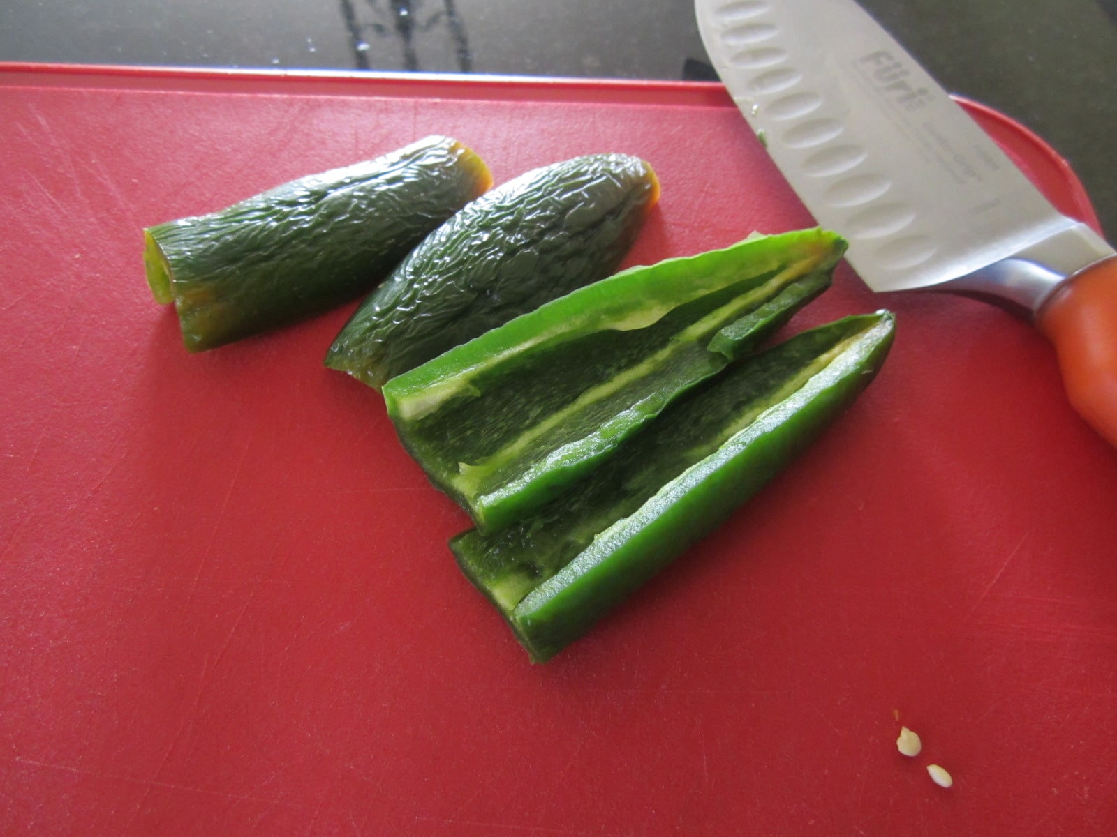 Cut the ends, then cut lengthwise, and remove the seeds. If you want some extra hotness, keep a few in. I chose not to for this sandwich.