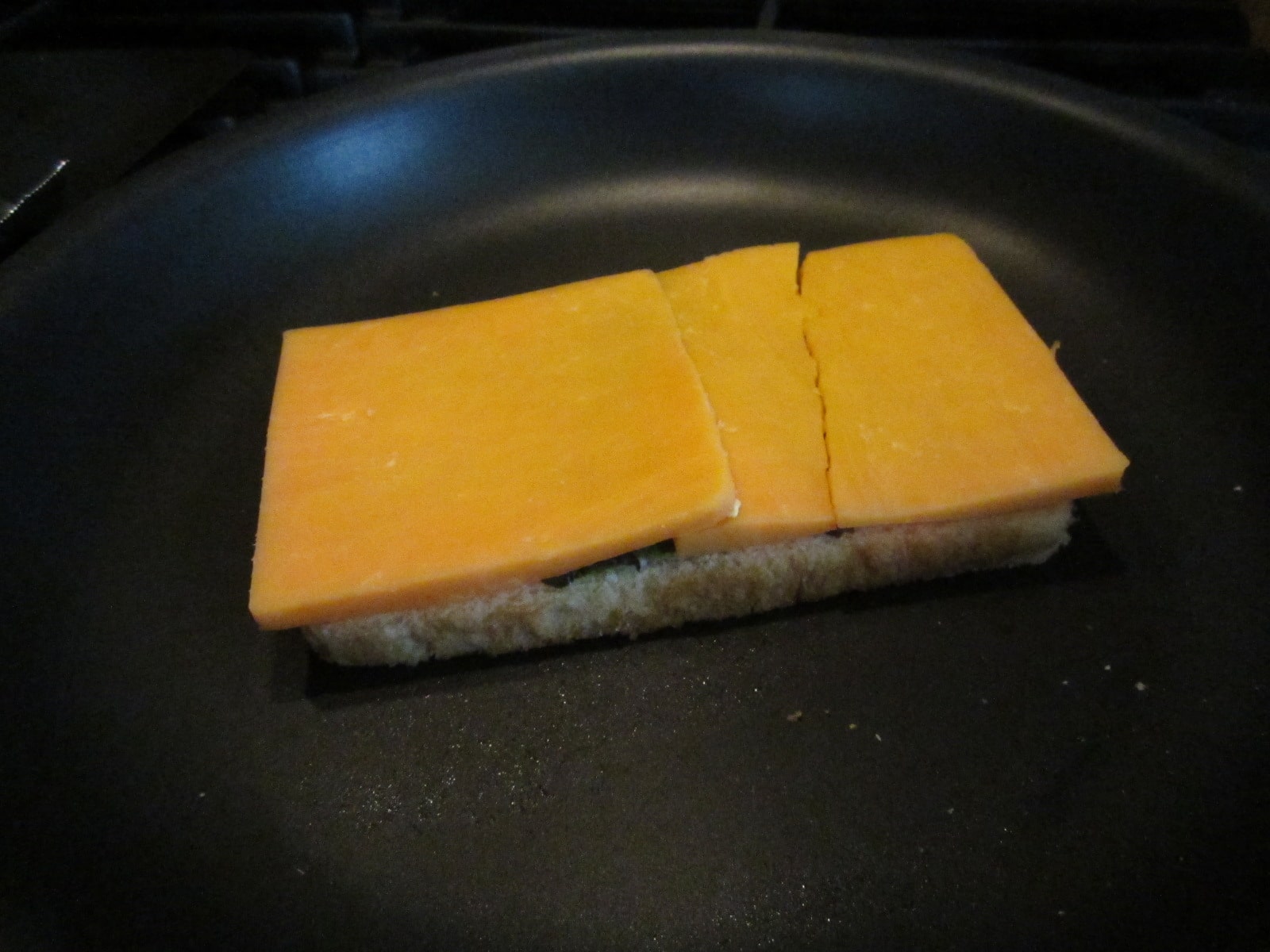 A couple good, hearty slices of sharp cheddar.