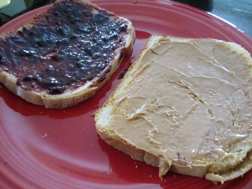 I buttered one side of the bread (for grilled cheese-style grilling), then flipped over and gave one piece jam and the other piece peanut butter.