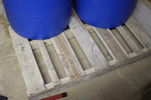 water barrels on a wood pallet