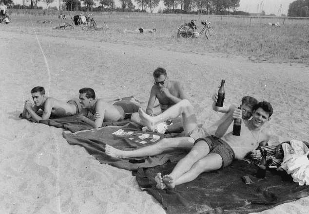 vintage 1940s men sunbathing playing cards beach