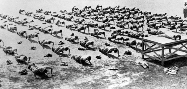 vintage soldiers doing push ups in formation 