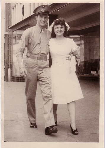 Get creative with your date ideas by exploring an old photo featuring a man and woman in uniform.