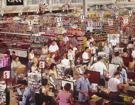 A crowd of restless people in a grocery store, limited by social distancing measures.