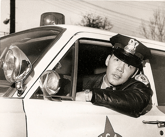 A police officer in a patrol car.