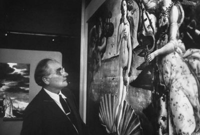 A man in a suit admiring a Renaissance painting.