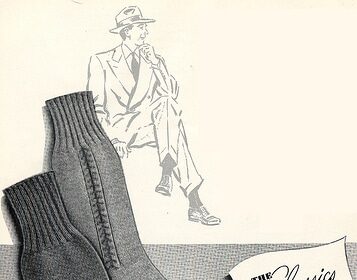 A pair of grey socks perfect for a man's guide to style, featuring a man in a suit.