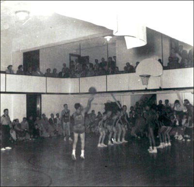 An old black and white photo capturing a clutch basketball game moment.