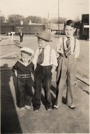 Three boys in sailor suits, embodying the Boyhood Archetypes, standing next to each other.