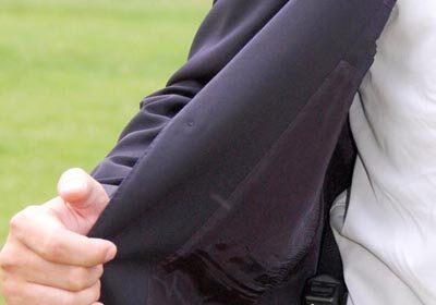 A stylish man with a concealed carry in his pocket.