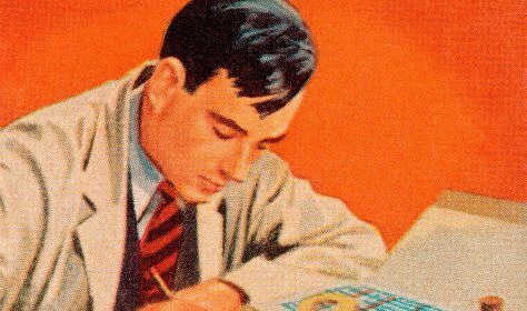A man is sitting at a table, deeply engrossed in writing on a piece of paper, exploring why.
