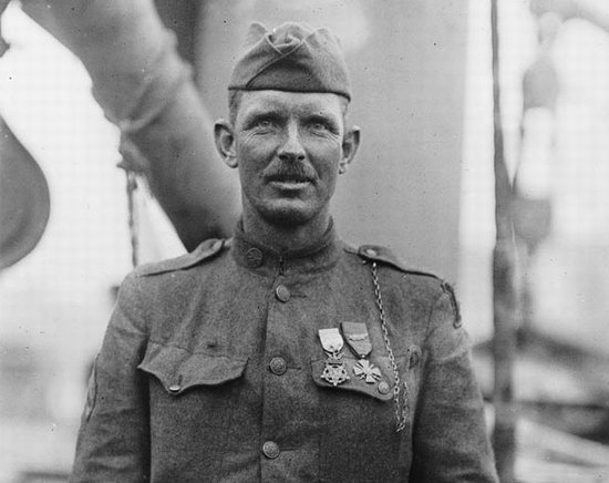 Sergeant Alvin C. York, a man in uniform, standing in front of a ship after making a difficult decision.