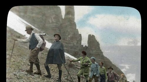 A group of people hiking up a mountain, adhering to Hiking Etiquette.
