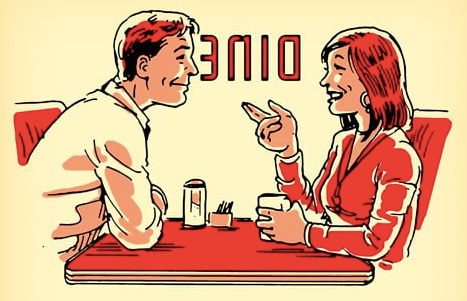 A man and woman dining at a table with charisma.
