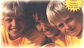 The cover features three boys playing soccer.