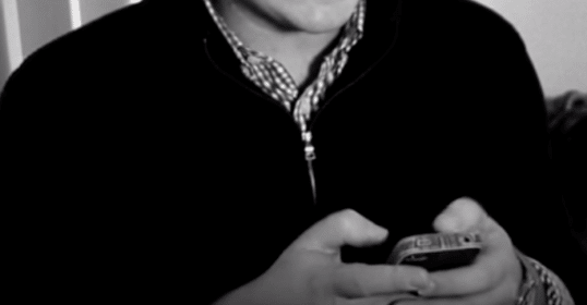 A man holding a cell phone.
