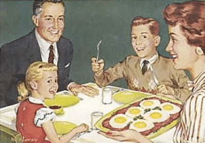 The family wrong sits at the table and eats breakfast.