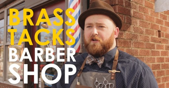 Barber shop specializing in *haircuts* and shaves.