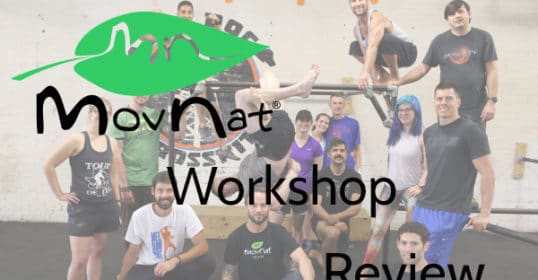 A group of people posing for a photo during a MovNat Workshop review.