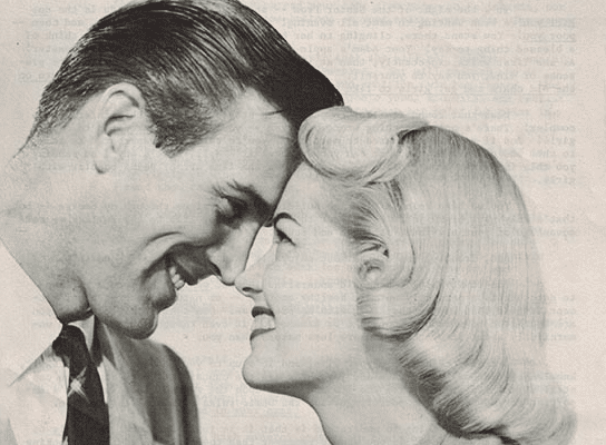 A woman and man are smiling at each other in an old newspaper.