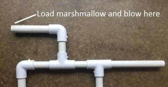 Tutorial on how to make a Marshmallow shooter using a white pipe with the words 