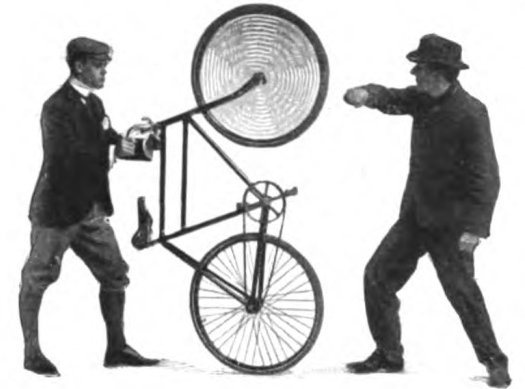 Two men standing next to a bicycle.