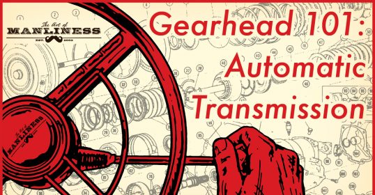 A hand expertly grips a steering wheel, showcasing an understanding of driving.