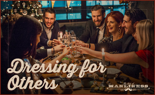 A group of people toasting at a table for others.