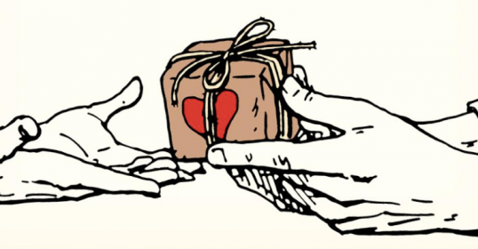 Two hands exchanging a romantic gift.