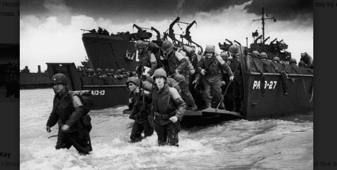 A black and white photo of soldiers on a boat, remembering D-Day.
