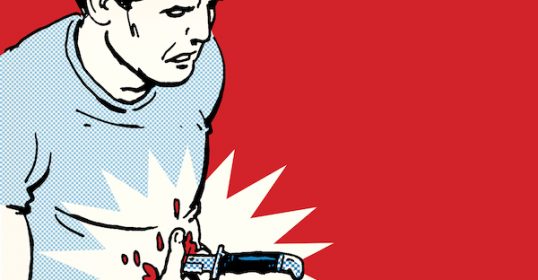 A man with an impalement wound in his stomach is being treated.