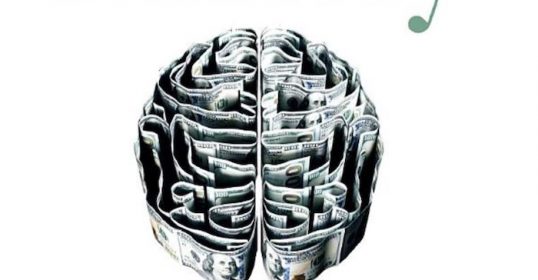 An image of a wealthy brain filled with money.