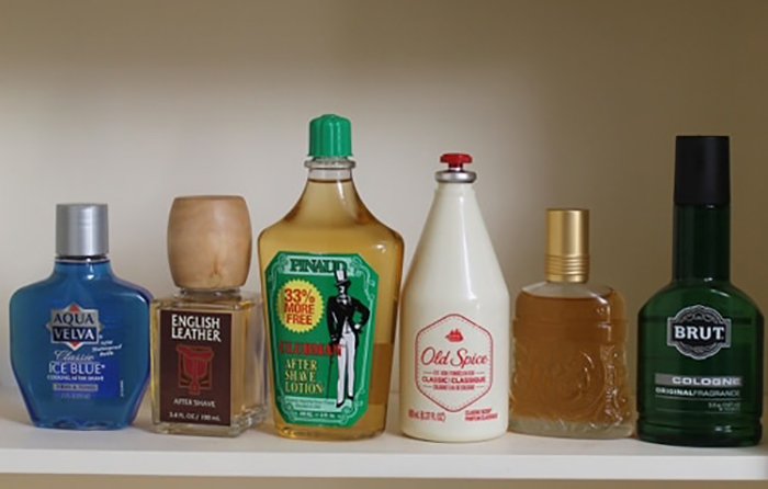 A collection of various alcoholic beverages displayed on a shelf at the drugstore.