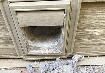 A man is hammering on a house.