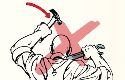 A man is using a hammer.