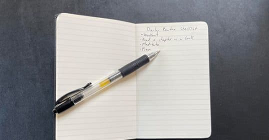 A notebook open to a page with a handwritten 