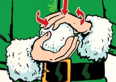 Person in a santa costume holding a perfect snowball.