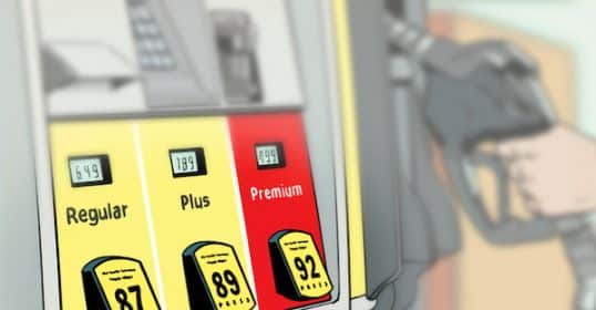 A person is filling up their car at a gas station with options for regular, plus, and premium Gas Octanes visible on the pump.