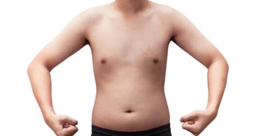 Child standing with hands on hips, displaying bare torso, embodying the 