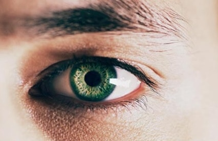 Close-up of a person's green eye, unpacking the emotion no one likes to talk about.