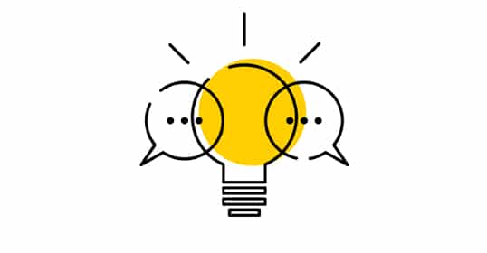 Two speech bubbles overlapping in front of a lightbulb, representing Curiosity Conversations or idea exchange.