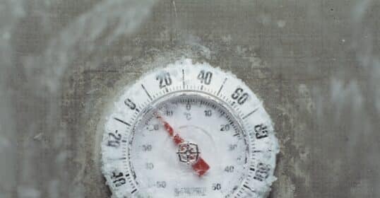 A frozen thermometer displaying sub-zero temperature prepares for an Arctic Blast.