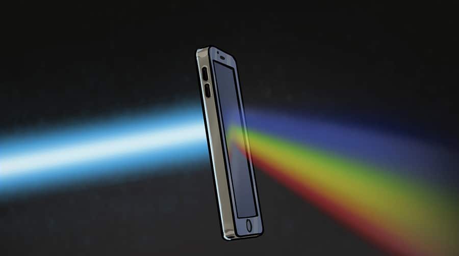 Smartphone emitting colorful light spectrum on a dark background, illustrating communication or signal concept.