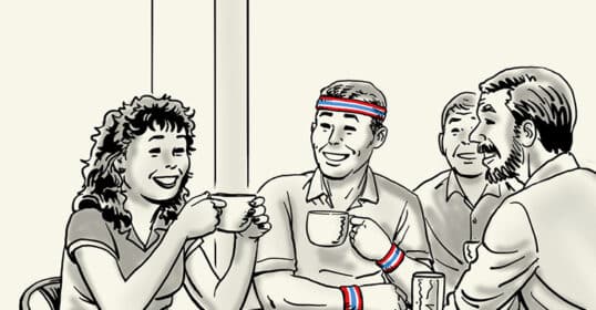 A group of four people sit around a table, smiling and drinking from cups, effortlessly maintaining social fitness. One person wears a headband and wristbands.
