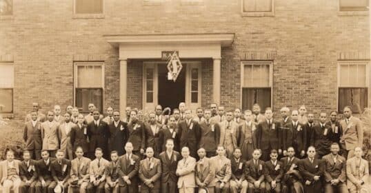 a group of men posing for a photo