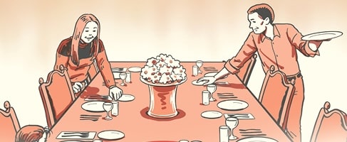 Two people demonstrate how to set a table, arranging plates, glasses, and utensils with care. A vase of flowers completes the elegant table setting at the center.