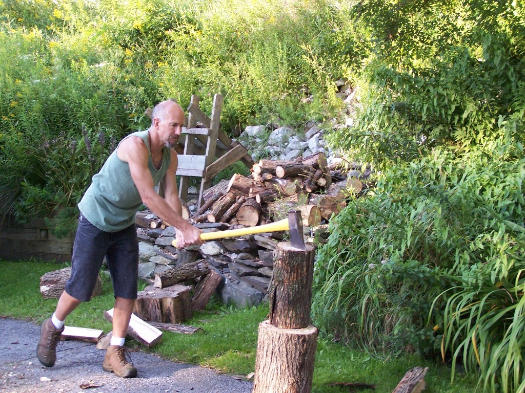 Uncle buzz splitting wood get workout outdoors.