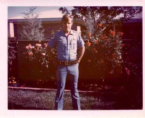 Tom McKay standing in home garden.