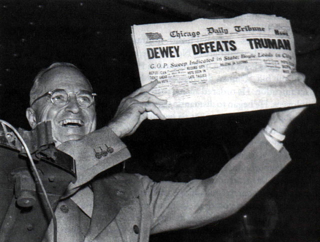 Vintage Harry Truman holding newspaper.